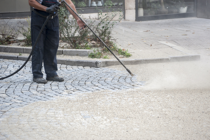 worker, cleaning the streets with a breeze of air
